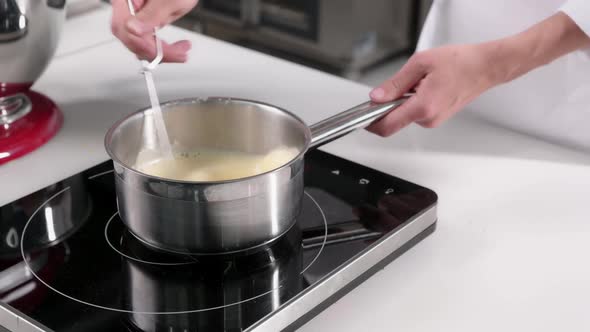 Pastry Chef Makes Cream for the Cake