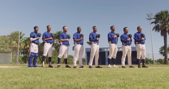 Baseball players standing on line