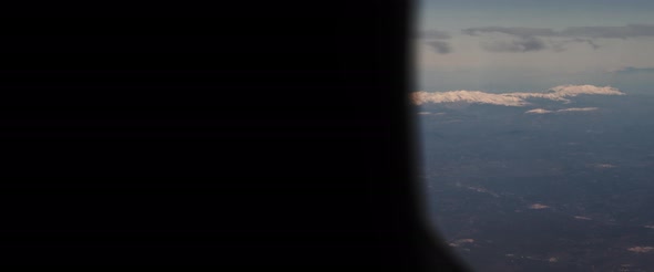 Aerial view of snowy mountain peaks and beautiful landscape.