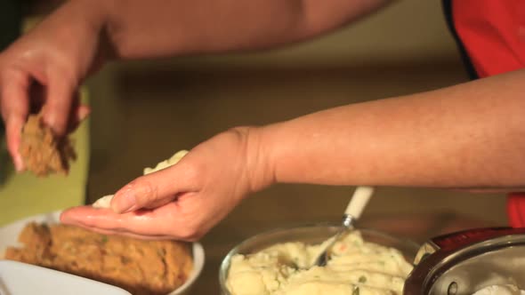 Pupusas making by woman hands close up