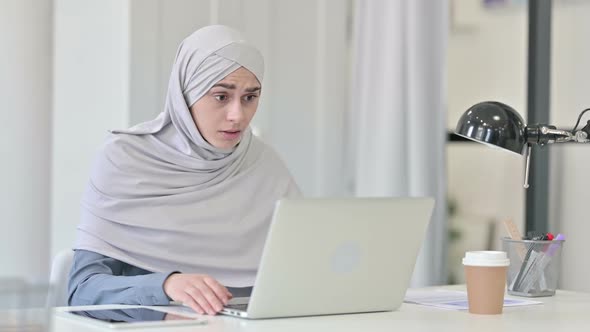 Young Arab Woman with Laptop Having Loss Failure