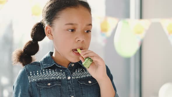 Group of Children Celebrating Birthday Party at Decorated Home