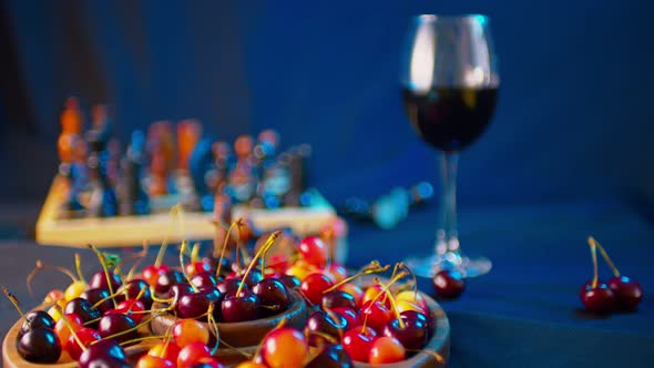 Close Up of Big Plate with Different Varieties of Sweet Cherries on Table