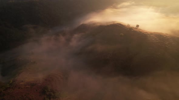 A sea of clouds above the valley and the mountains in the background