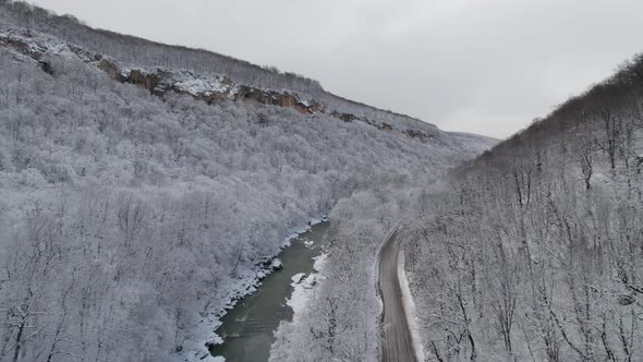 Aerial View of Plateau LagoNaki Mountain Twisted Road in the Winter and Driving Car