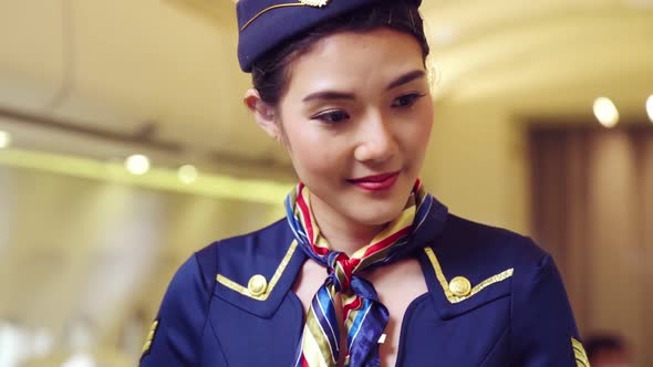 Cabin Crew or Air Hostess Working in Airplane