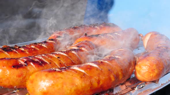 Sausages Grilling on Gas Grill