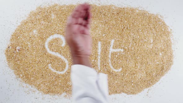 Hand Writes On Sand Salt