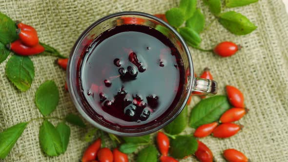 Top View Of Natural Rosehip tea, Homeopathy, Herbal Tincture. Red Tea.