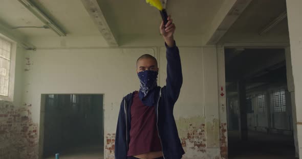 Fashionable young man in an abandoned warehouse