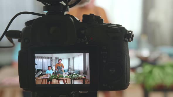 Display Camera Of Asian Father And Son Streaming Live Video With Camera While Cooking At Home