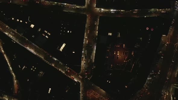 AERIAL: Slow Overhead Shot of City at Night with Lights and Traffic, Cologne, Germany 