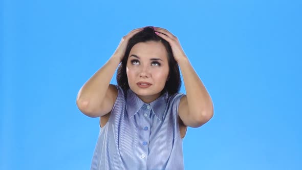 Portrait of Brunette Woman Putting Up Hands To Feel the Rain Start. Slow Motion