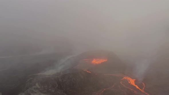 Volcanic Eruption With Lava Fountain And Rivers Flowing Downhill. - Aerial Shot