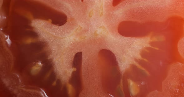 Sliced tomato rotating close up