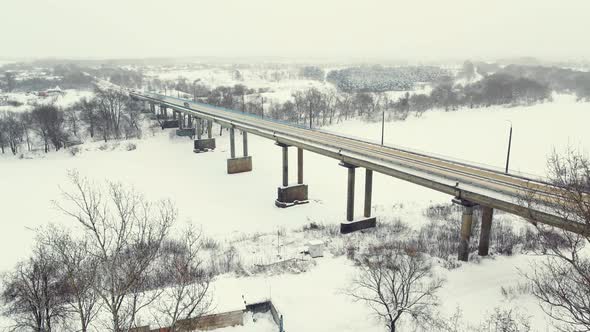 Snowy Winter Landscape Aerial View Road Bridge and Frozen River