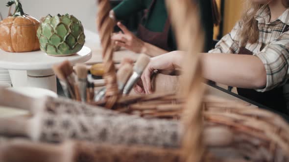 Potter Masterclass Man and Woman are Working with Pottery Wheel Making Pots During Master Class for