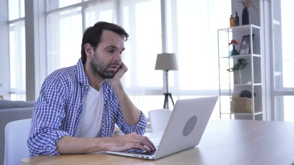 Sleeping Tired Casual Beard Man While Working on Laptop