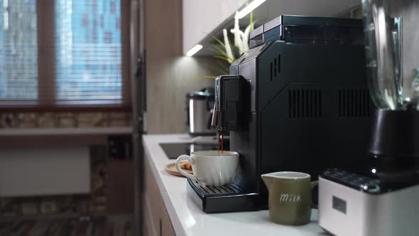 Automatic Coffee Machine Makes a Cup of Morning Coffee