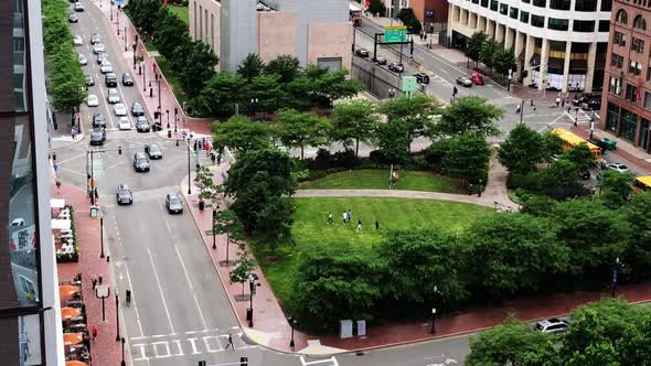 View of the Rose Kennedy Greenway and traffic in the financial center of downtown Boston