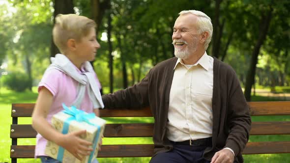 Grandson Gives Birthday Present to Grandfather, Love and Attention to Old People