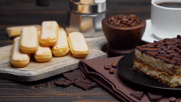 Portion of Traditional Italian Tiramisu Dessert Cup of Espresso Mocha and Coffee Beans