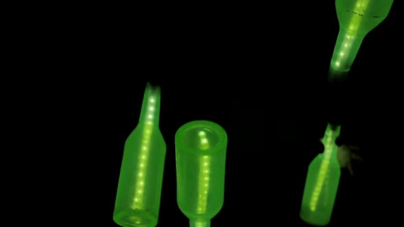 Flipping and Spinning in the Air Glowing Green Bottles in Darkness Invisible Juggler Juggles 