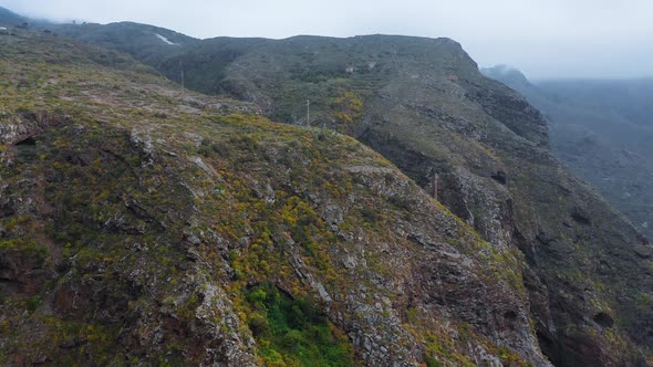 Flight Along a Rocky Landscape Covered with Sparse Vegetation