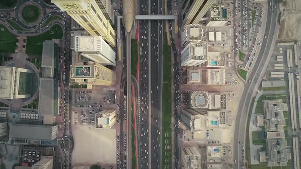 Aerial view of Dubai colourful skyscrapers, and long busy road ,UAE.