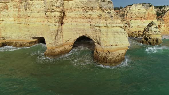 Aerial Round View on Cliffs and Waves in Algarve