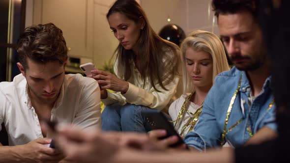 Bored friends on party celebrating new year. Shot with RED helium camera in 8K