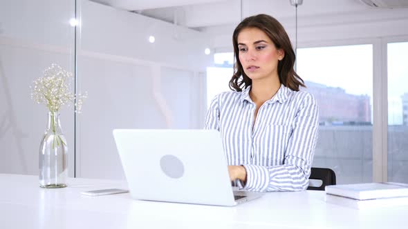 Wondering Young Hispanic Woman Gesturing Shock at Work, Astonished