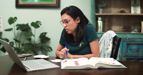 Young Hispanic Woman Asks Question During Online Lecture