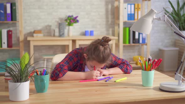 Portrait of a Lonely Child Autism or Having Mental Disorders Draws Sitting