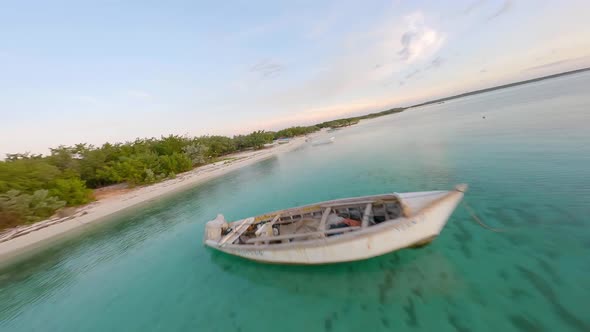 Remote Playa Cabo Rojo in the Caribbean with flat azure ocean; FPV drone