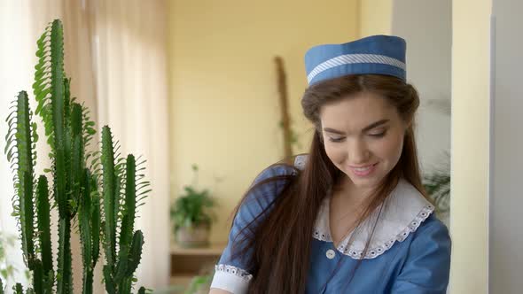 Young Housemaid Smiling