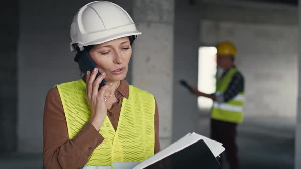 Waist up video of female caucasian engineer on the construction site