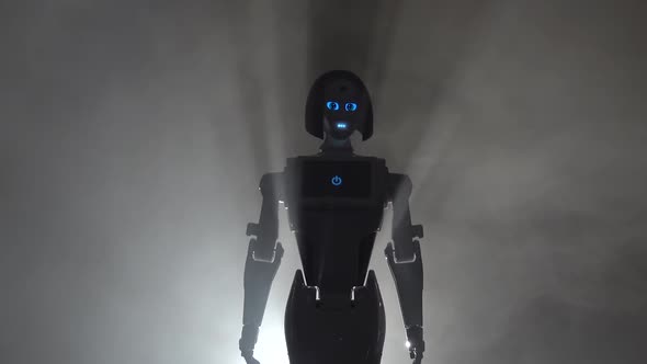 Robot Leaves the Smokescreen. Black Smoke Background