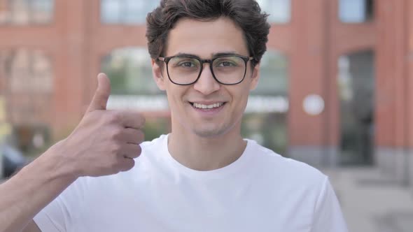 Outdoor Portrait of Thumbs Up By Young Man