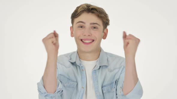 Successful Young Man Celebrating on White Background