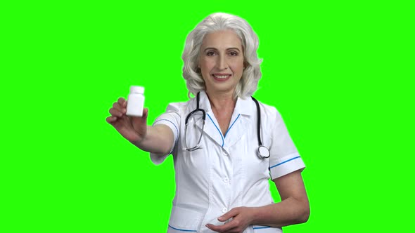 Doctor Woman Showing Pills and Thumb Up