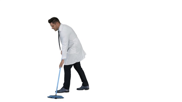 Man in white robe sweeping the floor and talking on white