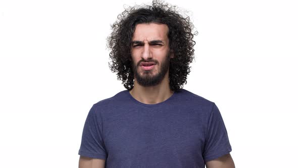 Portrait of Caucasian Unhappy Man in Casual Clothing Expressing Rejection with Disgust on His Face