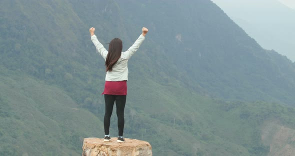 Asian Woman Win On Top Of Mountain