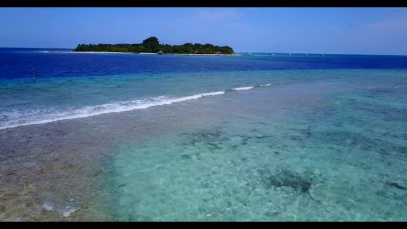 Aerial drone view travel of idyllic lagoon beach lifestyle by blue lagoon with white sandy backgroun