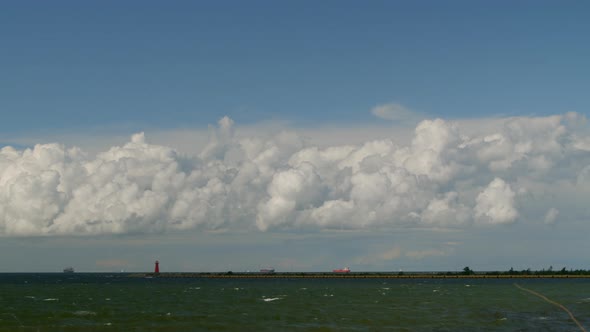 Timelapse Movement of Cumulus Rain Clouds Over the Sea with Ships