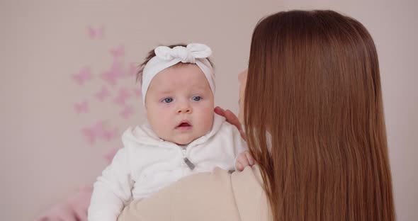 Mom Worries About Newborn Baby. Hold The Baby In Your Arms.