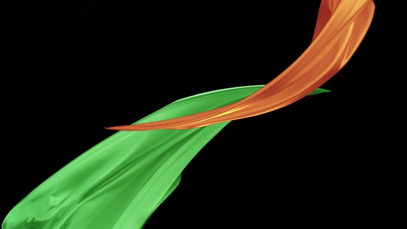 Orange and green color fabrics flying in midair, Slow Motion