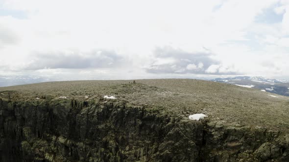 Stunning aerial view of Ranastongi Peak in Hemsedal, Norway. Wide shot, pull back.