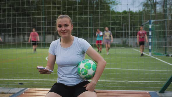 Portrait of Woman Football Player in the Park